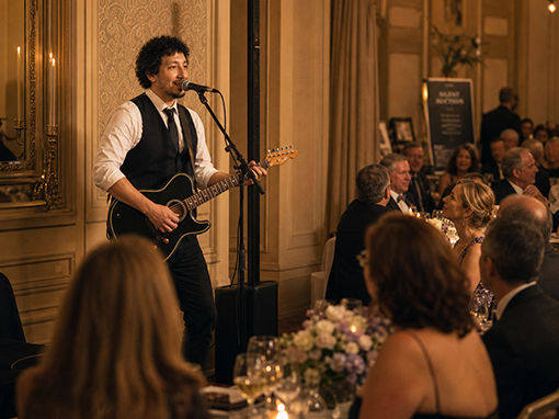 Marcel Acoustic performing at a charity fundraiser gala dinner
