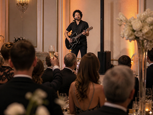 Marcel Acoustic performing at an upscale corporate gala or product launch